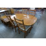 A Danish teak dining table and four chairs