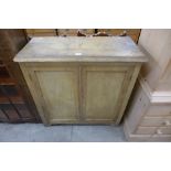 A pine and beech two door cupboard