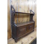 A Victorian Gothic Revival oak wall mounted cabinet