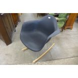A black plastic and chrome rocking chair