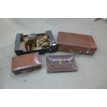Three leather cases and carved wood elephants