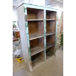 A painted pine cupboard (lacking doors)