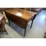 A George III mahogany drop-leaf dining table