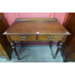A Victorian Jas. Schoolbred & Co. walnut two drawer side table