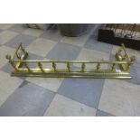 A Victorian style brass fender