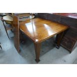 A Victorian mahogany extending dining table