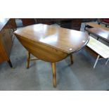 An Ercol Golden Dawn drop leaf table