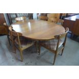 A McIntosh teak extending dining table and six chairs