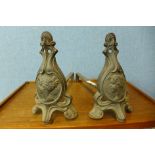 A pair of French Art Nouveau cast metal andirons