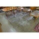 A set of eight Eames style metal chairs