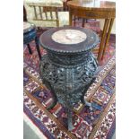 A 19th Century Chinese carved rosewood and marble topped jardiniere stand