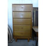 A mid 20th century Staverton oak fitted five door cabinet