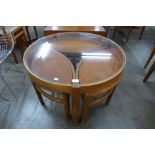 A Nathan teak and glass topped circular nest of tables