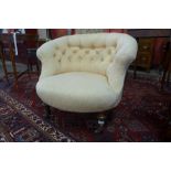 A Victorian walnut and upholstered lady's tub chair