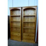 A pair of pine freestanding open bookcases