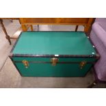 A green steamer trunk