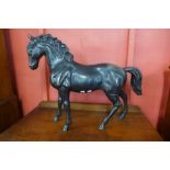 A large bronze figure of a stallion