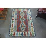 A Turkish hand made patterned rug, 150 x 109cm