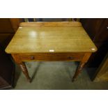 A Victorian oak single drawer side table