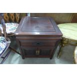 A Chinese hardwood bedside table