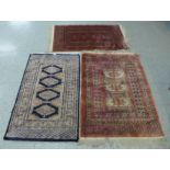 Three assorted rugs