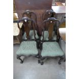 A set of four George I style mahogany dining chairs