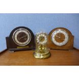 Two oak mantel clocks and a brass anniversary clock