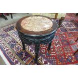 A 19th Century Chinese carved rosewood and marble topped jardiniere stand