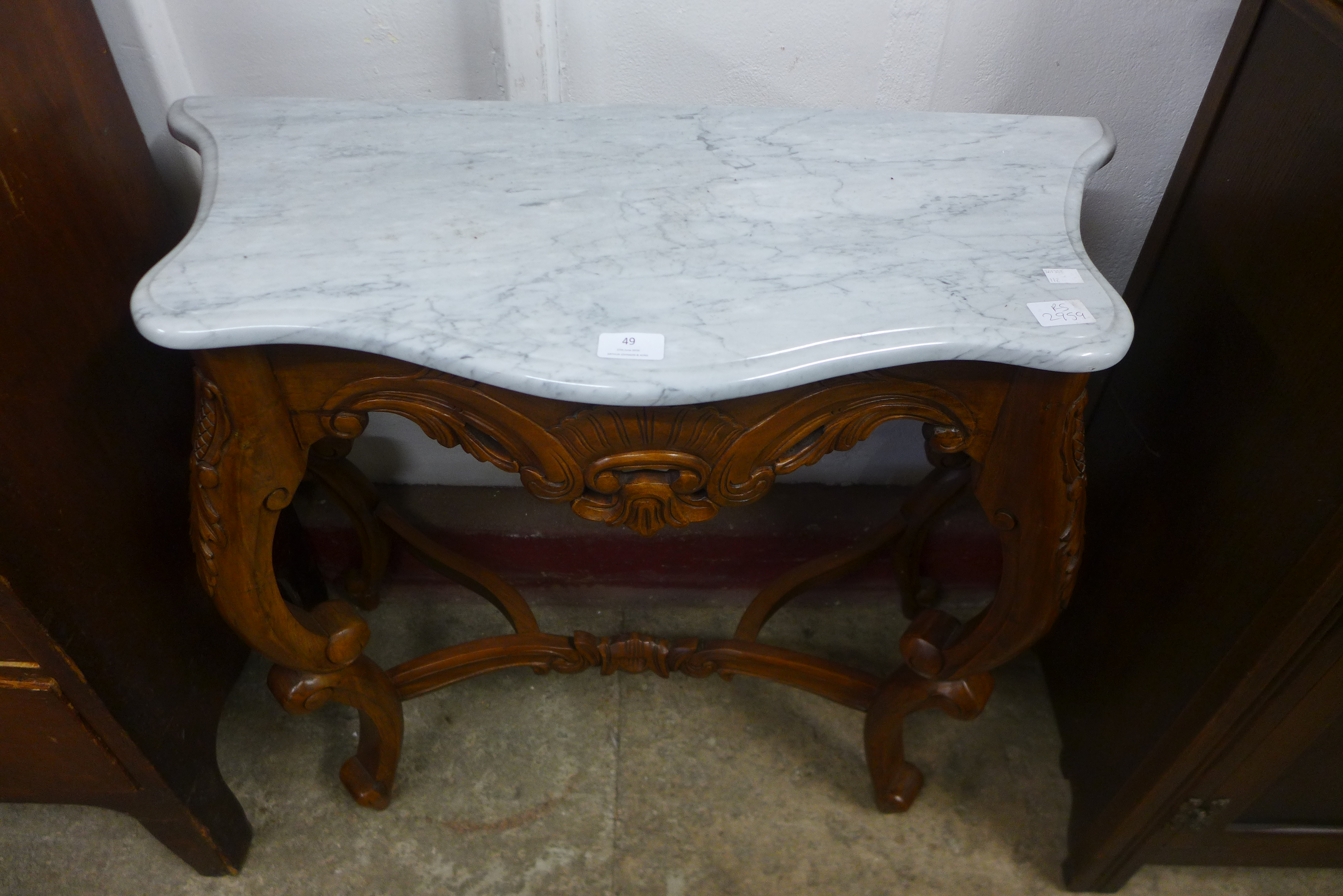 A small rococo style mahogany and marble topped console table
