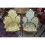 A pair of Edward VII inlaid mahogany and upholstered tub chairs