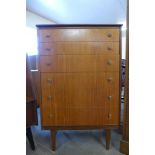 A teak chest of drawers