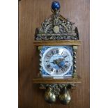 A Dutch oak and brass double weight wall clock