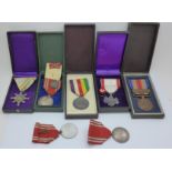 Seven WWII Japanese medals, five with boxes