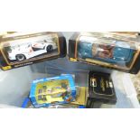 Six die-cast model vehicles including 1 1/18th scale Sauber Formula 1, all boxed