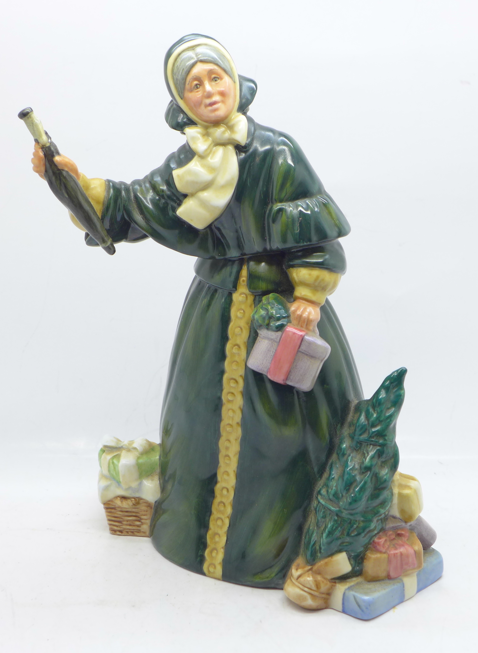 A Royal Doulton figure, Christmas Parcels, a/f (umbrella handle re-glued)