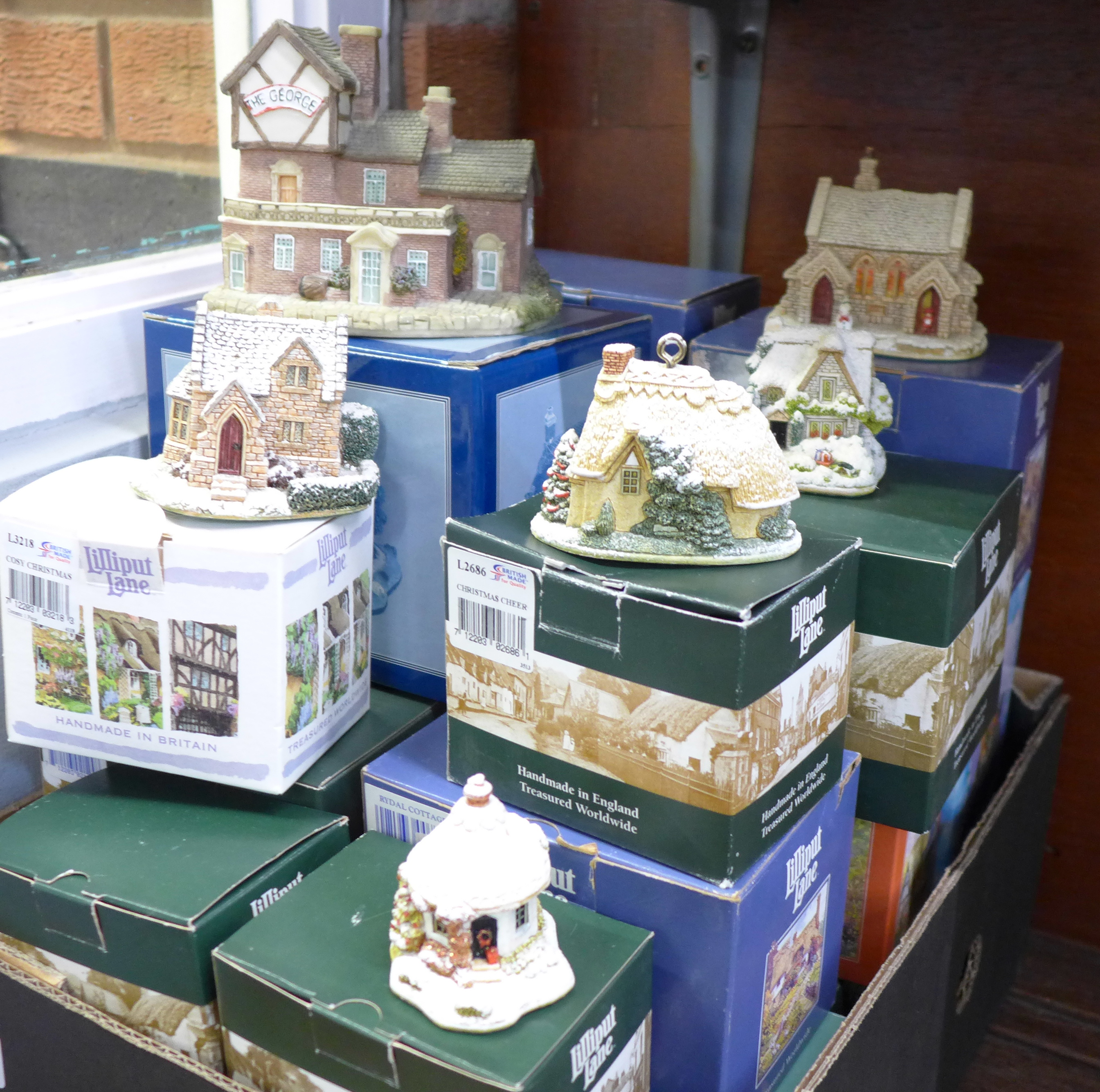 A collection of Lilliput Lane model cottages, boxed