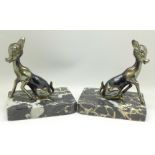 A pair of Art Deco spelter 'Bambi' book ends on a marble base