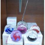 Eleven Caithness glass paperweights, boxed