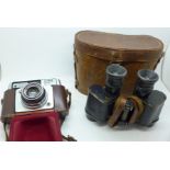 A pair of military issue binoculars, Hunsicker & Alexis, Paris, and an Ilford Sportsman camera