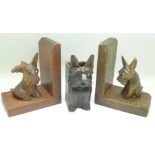A pair of Black Forest carved dog bookends and a wall pocket