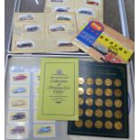 Motoring;- display case containing The Franklin Mint Collection of antique car coins, Vanguard log