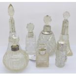 Seven silver mounted scent bottles