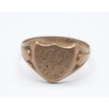 A 9ct gold shield ring, engraved, 2.6g, L