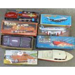 Four boxed toys, Minister Delux Car, Train, long range clockwork Cabin Cruiser and Jumbo Jet