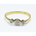 An 18ct gold, platinum set three stone diamond ring, 1.4g, N