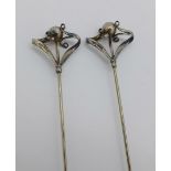 Two hallmarked silver mounted hat pins, Charles Horner