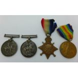 A trio of WWI medals to L-6434 Cpl. E. Oliver R.F.A. and a British War Medal to 52789 Pte. T.W. Ward