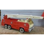 A Tonka Toys metal fire engine with ladder