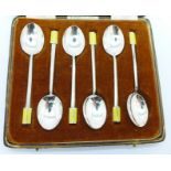 Six Art Deco silver and enamel spoons in fitted case, 48g