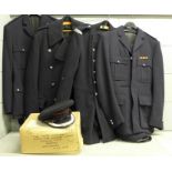 Four fireman's uniforms including a dress coat, a peaked cap and cloth badge